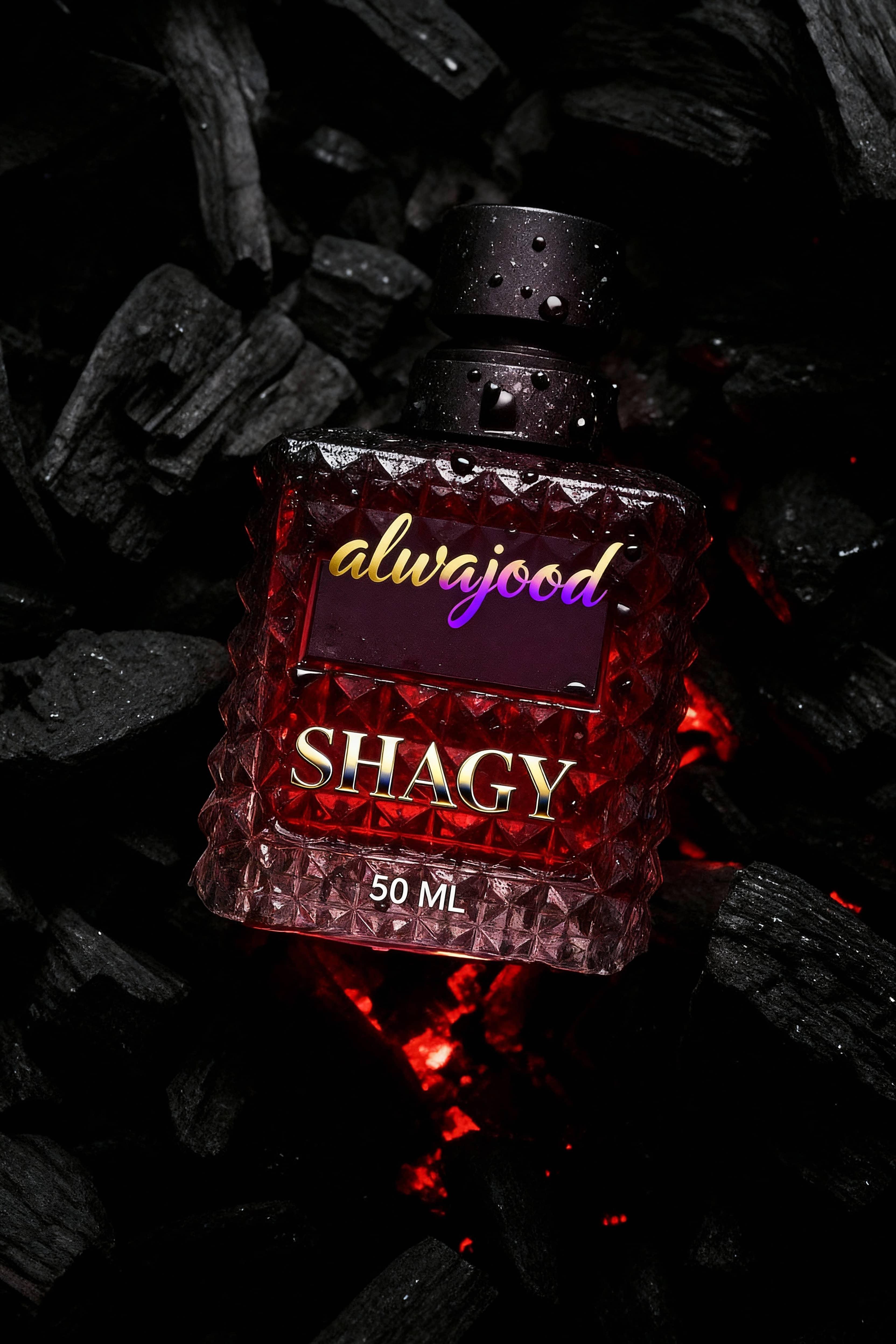 Red bottle labeled 'Shagy' with 'alwajood' on a dark background